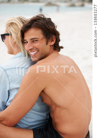 Couple, beach sand and sitting hug for holiday vacation, sunshine lovers or sea salt hair. Man, portrait and woman relax for partnership connection or ocean view, romantic or summer tropical travel 138683277