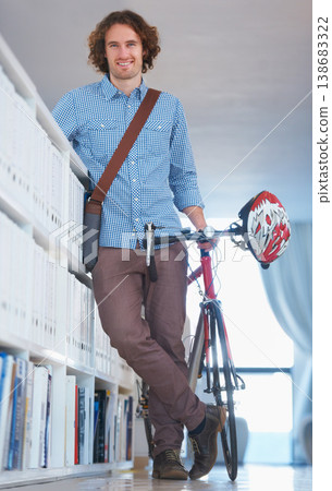 Man, portrait with bike and sustainable travel, worker at office with carbon footprint, transportation and creative at startup. Happy, cycling for eco friendly bicycle and professional at workplace Man, portrait with bike and sustainable travel, worker at office with carbon footprint, transportation and creative at startup. Happy, cycling for eco friendly bicycle and professional at workplace 138683322