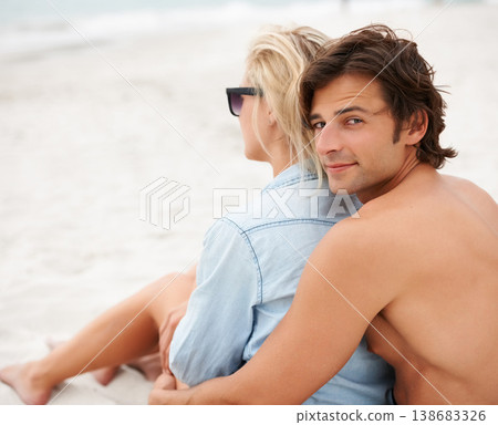 Couple, beach sand and sitting embrace on holiday vacation, sunshine lovers or sea salt hair. Man, portrait or woman relax for partnership connection or ocean view, romantic or summer tropical travel Couple, beach sand and sitting embrace on holiday vacation, sunshine lovers or sea salt hair. Man, portrait or woman relax for partnership connection or ocean view, romantic or summer tropical travel 138683326