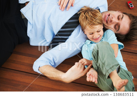 Father, child and playing on floor with happy, family home and support of businessman with kid. Man, kid and game in freedom together to relax, trust and love in room with care, house and wellness Father, child and playing on floor with happy, family home and support of businessman with kid. Man, kid and game in freedom together to relax, trust and love in room with care, house and wellness 138683511