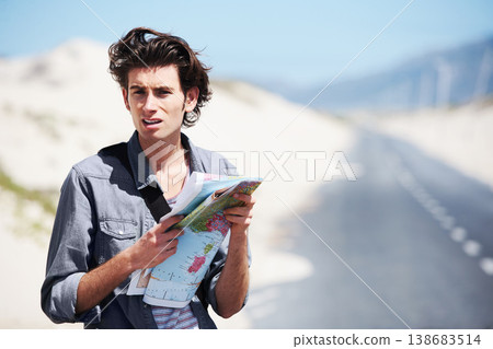 Lost, man and reading a map on a road trip, journey or planning travel on a highway. Check, location and confused person with paper maps, destination and search for direction to city in countryside 138683514