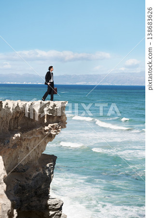 Thinking, cliff and business man by ocean for freedom, opportunity and career in nature. Professional, mockup and corporate worker on rocks edge for work challenge, ideas and future with scenic view Thinking, cliff and business man by ocean for freedom, opportunity and career in nature. Professional, mockup and corporate worker on rocks edge for work challenge, ideas and future with scenic view 138683626