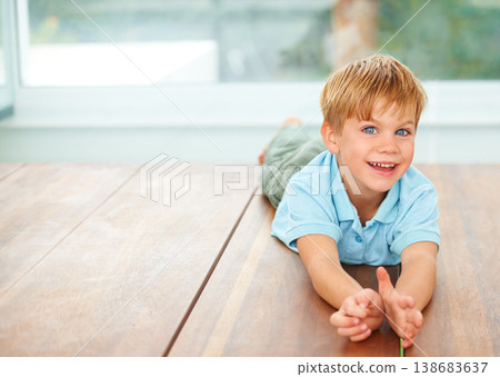 Happy, portrait and young child on floor in family home, wellness and playing games in lounge. Boy, face and smile in living room for fun, care and excited english kid, growth and toddler development 138683637