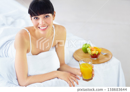 Woman, portrait and juice for breakfast in bed with glass drink, fresh beverage or morning hydration liquid. Organic fruits, healthy lifestyle or happy person thirsty, smile and relax in home bedroom Woman, portrait and juice for breakfast in bed with glass drink, fresh beverage or morning hydration liquid. Organic fruits, healthy lifestyle or happy person thirsty, smile and relax in home bedroom 138683644