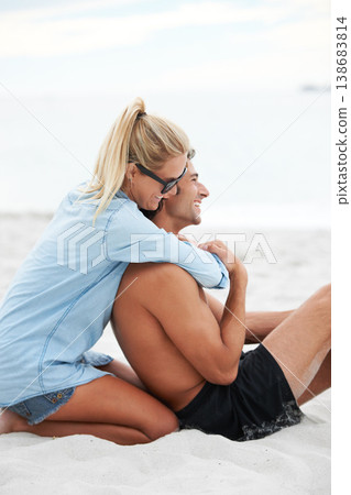 Couple, holiday and beach sand hug smile for Maldives summer, outdoor romance or vacation. Man, woman or happy at ocean fresh air in embrace for connection or love trust together, relax in sunshine 138683814