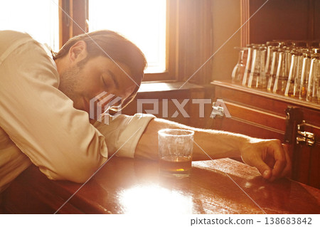 Sleeping, counter and man with whiskey, alcoholic and unhealthy habit with depression, tired and overworked. Person, addict and guy with a drink, exhausted and drunk with handover, brandy and booze Sleeping, counter and man with whiskey, alcoholic and unhealthy habit with depression, tired and overworked. Person, addict and guy with a drink, exhausted and drunk with handover, brandy and booze 138683842