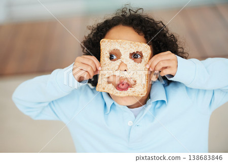 Child, playful or face food mask or bread funny, nutrition hungry or eating health value. Boy, tongue or brown diet fibre for kid vitality cooking or meal prep dinner humor for snack, lunch or comedy 138683846