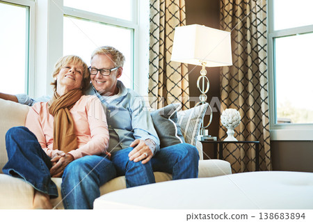 Relax, home and mature couple on sofa hug for bonding, healthy relationship and marriage. Retirement, happy and senior man and woman smile on couch for love, commitment and embrace in living room Relax, home and mature couple on sofa hug for bonding, healthy relationship and marriage. Retirement, happy and senior man and woman smile on couch for love, commitment and embrace in living room 138683894