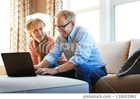 Laptop, mature or happy couple planning savings, property investment or online shopping together. Ecommerce website, smile or senior people typing to search for investing news on pc on sofa at home Laptop, mature or happy couple planning savings, property investment or online shopping together. Ecommerce website, smile or senior people typing to search for investing news on pc on sofa at home 138683962