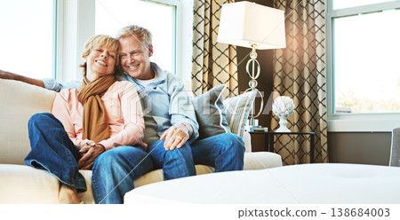 Relax, home and portrait of mature couple on sofa for bonding, healthy relationship and marriage. Retirement, home and senior man and woman on couch for love, commitment and embrace in living room Relax, home and portrait of mature couple on sofa for bonding, healthy relationship and marriage. Retirement, home and senior man and woman on couch for love, commitment and embrace in living room 138684003