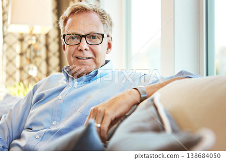 Portrait, senior or happy man in living room to relax with freedom on couch or sofa at home. Apartment, face or mature person with smile or wellness in retirement, lounge or house for resting break Portrait, senior or happy man in living room to relax with freedom on couch or sofa at home. Apartment, face or mature person with smile or wellness in retirement, lounge or house for resting break 138684050