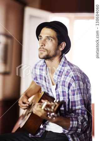 Guitar, thinking or man in home for music, performance or entertainment with sound, rhythm or talent. Learning solo, artist or creative musician playing an instrument for artistic expression alone Guitar, thinking or man in home for music, performance or entertainment with sound, rhythm or talent. Learning solo, artist or creative musician playing an instrument for artistic expression alone 138684060