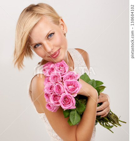 Rose, bouquet and smile with portrait of woman in studio for floral, young and romance. Plants, gift and happy with female person and flowers on white background for elegant, love and present 138684102