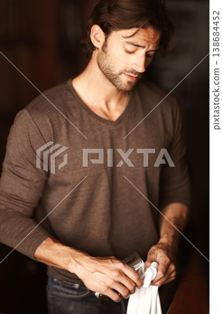 Bartender, man and polish glass in restaurant, cafe or small business to prepare in cafeteria. Cleaning, cloth and barman wipe cup, employee or professional waiter work in pub, coffee shop or service Bartender, man and polish glass in restaurant, cafe or small business to prepare in cafeteria. Cleaning, cloth and barman wipe cup, employee or professional waiter work in pub, coffee shop or service 138684452