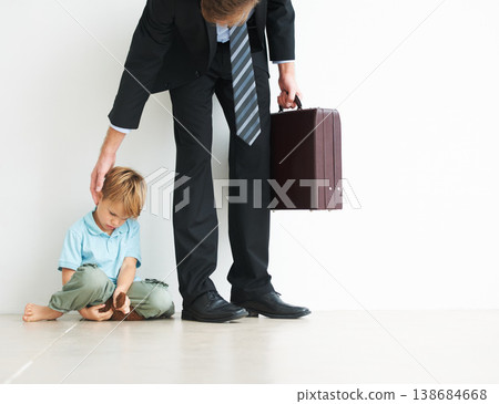 Businessman, work and home by child for sad, autism and touch head for care or stop fear, support and anxiety. Father, kid and mental health on floor to help son, tired man and professional in stress 138684668