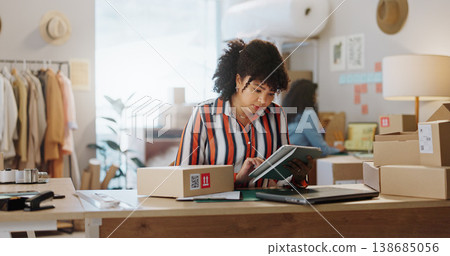 Woman, tablet and fashion in small business management, logistics or research at boutique. Female person or employee with boxes and technology for online search, supply chain or order at retail store Woman, tablet and fashion in small business management, logistics or research at boutique. Female person or employee with boxes and technology for online search, supply chain or order at retail store 138685056
