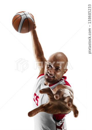 Basketball. Dynamic close-up of a basketball player in mid-air attempting a shot at the hoop during a game. Isolated 138685233