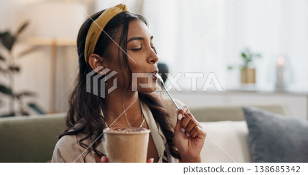 Woman, eating ice cream and sofa in house, thinking or idea for dessert, sweets or relax in living room. Girl, gelato or frozen yogurt for snack, lounge couch and home with memory, choice or decision Woman, eating ice cream and sofa in house, thinking or idea for dessert, sweets or relax in living room. Girl, gelato or frozen yogurt for snack, lounge couch and home with memory, choice or decision 138685342