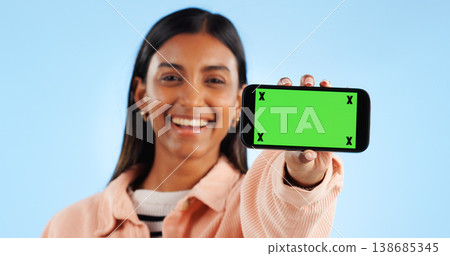 Phone green screen, studio portrait and happy woman show online presentation, social media info or commercial news. Tracking markers, smartphone chroma key and mockup space person on blue background Phone green screen, studio portrait and happy woman show online presentation, social media info or commercial news. Tracking markers, smartphone chroma key and mockup space person on blue background 138685345