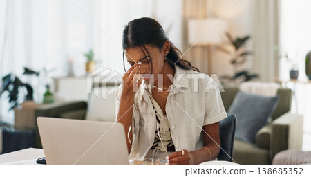 Woman, headache and work from home stress on laptop for marketing mistake, copywriting fail or online report. Young freelancer with pain, fatigue or health risk for social media deadline on computer 138685352