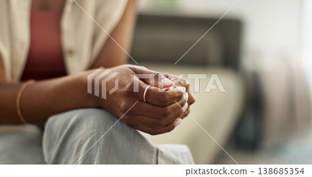 Anxiety, hands and closeup of woman on a sofa with fear, worry or mental health crisis at home. Stress, zoom and female person in living room with conflict trauma, ptsd or disaster, mistake or abuse Anxiety, hands and closeup of woman on a sofa with fear, worry or mental health crisis at home. Stress, zoom and female person in living room with conflict trauma, ptsd or disaster, mistake or abuse 138685354