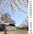 Castle and cherry blossoms shining in the spring sunlight 138685472