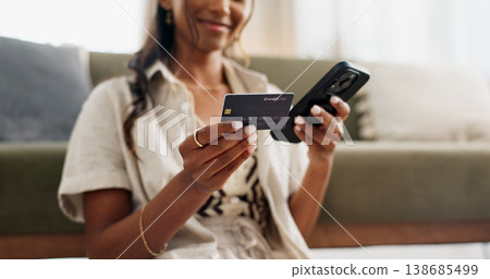 Happy woman, hands and phone with credit card for payment, online shopping or transaction in living room at home. Closeup of female person or shopper on mobile smartphone with debit for ecommerce 138685499