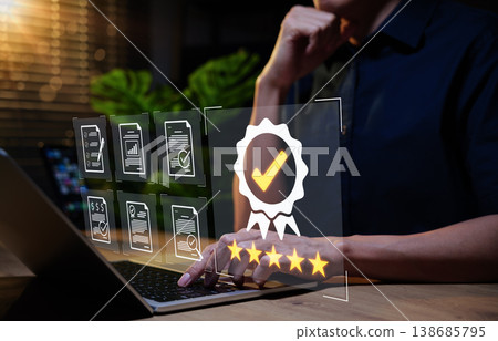 Quality Assurance and Certification Compliance Concept. Businessman using laptop with digital interface showing certification badge, quality assurance, standards compliance, excellence in performance, Quality Assurance and Certification Compliance Concept. Businessman using laptop with digital interface showing certification badge, quality assurance, standards compliance, excellence in performance, 138685795