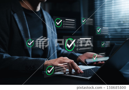 Digital checklist approval workflow concept. Businessman managing tasks on laptop and smartphone as verified task notifications appear, productivity, project management and business process completion Digital checklist approval workflow concept. Businessman managing tasks on laptop and smartphone as verified task notifications appear, productivity, project management and business process completion 138685800