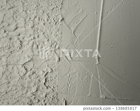 Cracked and textured white wall background with rough surface and visible paint layers Cracked and textured white wall background with rough surface and visible paint layers 138685817