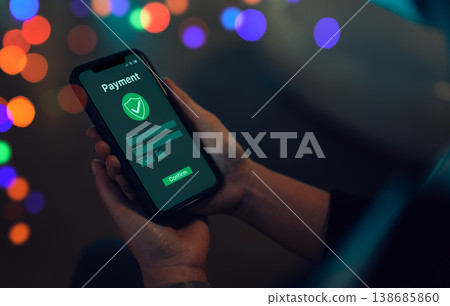 Mobile Payment and Secure Transaction Concept. Person using smartphone with secure digital payment interface, shield check, confirm button, transaction verification fintech protection trusted checkout Mobile Payment and Secure Transaction Concept. Person using smartphone with secure digital payment interface, shield check, confirm button, transaction verification fintech protection trusted checkout 138685860