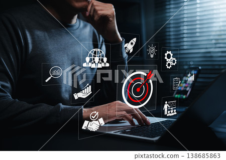 Business Target and Strategic Growth Concept. Businessman using laptop with target, analytics, teamwork, partnership, planning, strategy, goal achievement, market expansion, performance improvement Business Target and Strategic Growth Concept. Businessman using laptop with target, analytics, teamwork, partnership, planning, strategy, goal achievement, market expansion, performance improvement 138685863