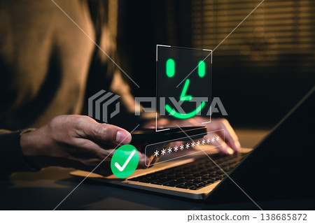 Secure Login and Password Verification Concept. Person using smartphone and laptop with password field, verified access icon and face ID representing secure sign in, identity check, account protection Secure Login and Password Verification Concept. Person using smartphone and laptop with password field, verified access icon and face ID representing secure sign in, identity check, account protection 138685872