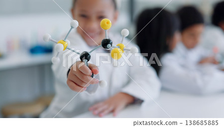 Child, molecular structure and education, learning science or knowledge in classroom or school laboratory. Student kid portrait with atom or molecule model for scientist, project and happy physics 138685885