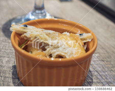A colorful dish that whets the appetite: a shrimp appetizer served in an orange bowl. A colorful dish that whets the appetite: a shrimp appetizer served in an orange bowl. 138686462