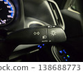 Close-up of the headlight control lever inside a car at night. 138688773