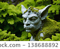 Stone Gargoyle Statue Covered in Moss 138688892