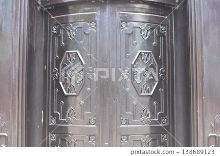 Fragment of antique Iron steel door England, Central Hong Kong. Old city background, retro style. Fragment of antique Iron steel door England, Central Hong Kong. Old city background, retro style. 138689123