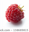 Single Raspberry with Water Droplets Isolated on a Clean White Background 138689815