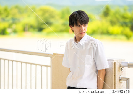 A male student standing outdoors 138690546