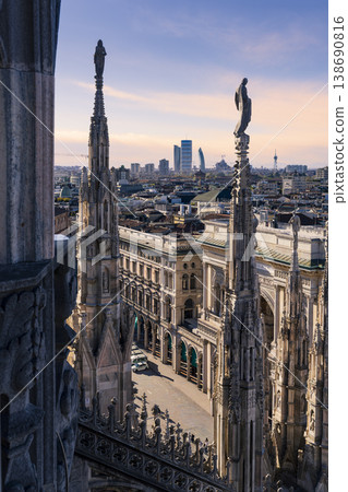 Statues of Duomo of Milan and Duomo square background Milan's financial district 138690816