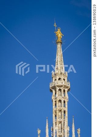 Madonnina golden statue of Virgin Mary on top of Milan Gothic Cathedral Madonnina golden statue of Virgin Mary on top of Milan Gothic Cathedral 138690819