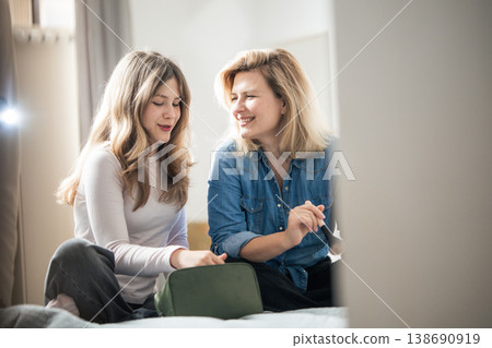 Mother and daughter bonding over makeup discussion Mother and daughter bonding over makeup discussion 138690919