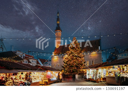 Illuminated Christmas Market and Town Hall in Tallinn Old Town under a starry night sky 138691197