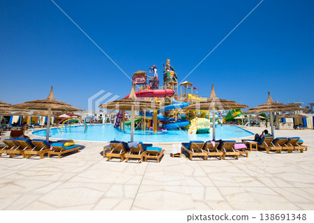 swimming pool with coconut tree and white umbrella swimming pool with coconut tree and white umbrella 138691348