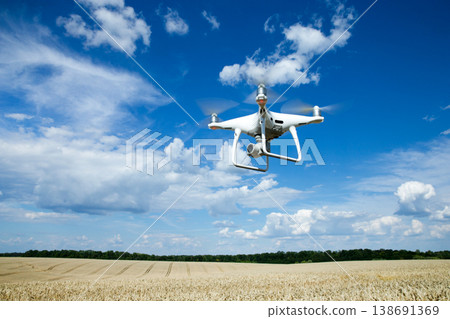 The drone copter flying with digital camera. The drone copter flying with digital camera. 138691369