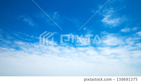 blue sky background with tiny clouds blue sky background with tiny clouds 138691375