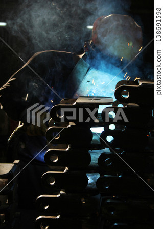 metal welding worker at factory 138691598
