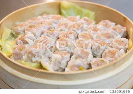 Delicious steamed shumai in a bamboo steamer Delicious steamed shumai in a bamboo steamer 138691686