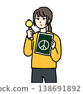 A woman holding a penlight and a sign with a peace sign. 138691892